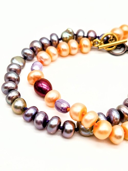 This is a picture of the bracelet with pearl knotting made in class.